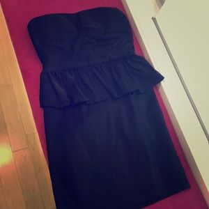 Strapless fitted black peplum dress